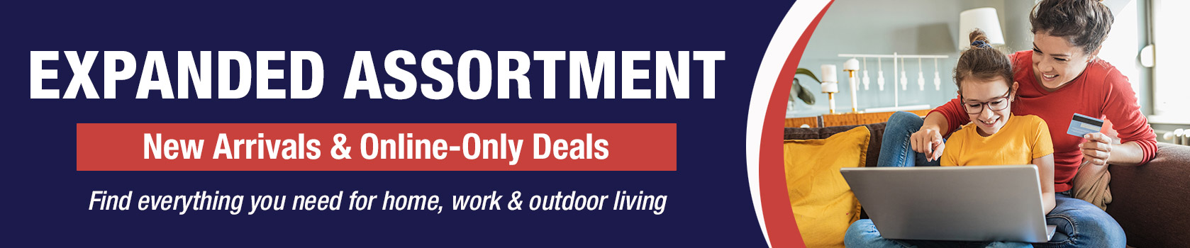 Adult and child smiling at laptop