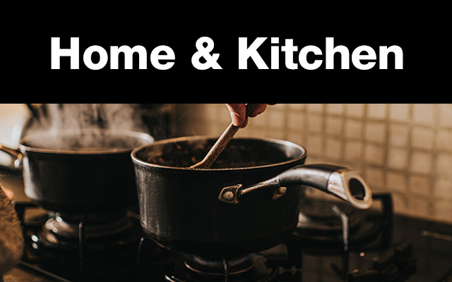 Wooden spoon stirring contents of a metal pot on stovetop