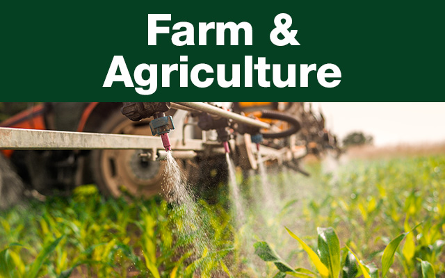 Farm and Agriculture banner with closeup of liquid sprayer in field