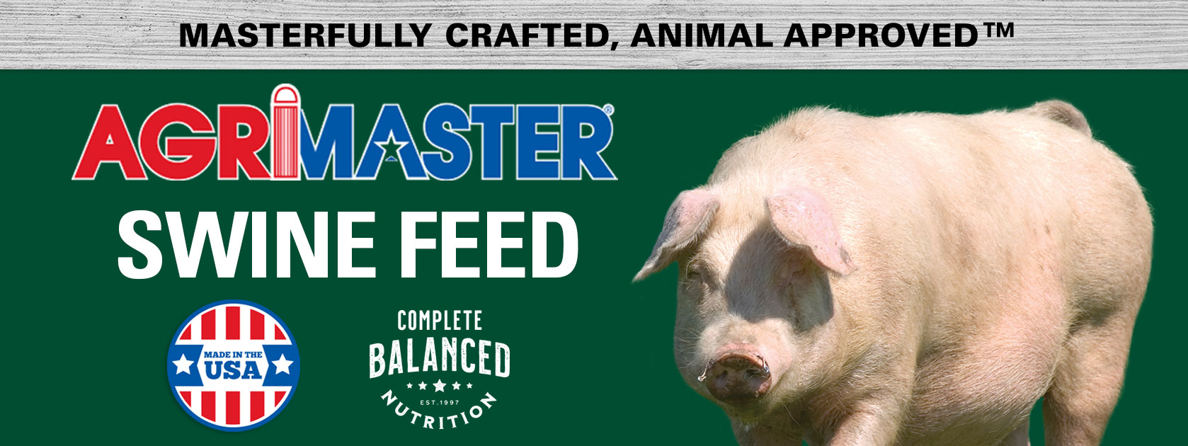 Pigs in a pen with Agrimaster logo